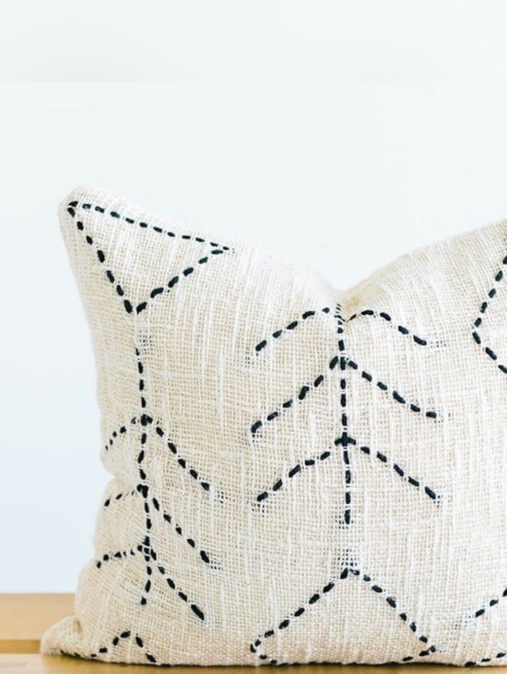Neutral Beige Throw Pillow with Black Stitch Pattern